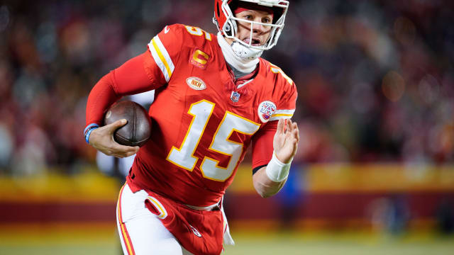 Jan 13, 2024; Kansas City, Missouri, USA; Kansas City Chiefs quarterback Patrick Mahomes (15) runs the ball against the Miami Dolphins during the first half of the 2024 AFC wild card game at GEHA Field at Arrowhead Stadium. Mandatory Credit: Jay Biggerstaff-USA TODAY Sports  